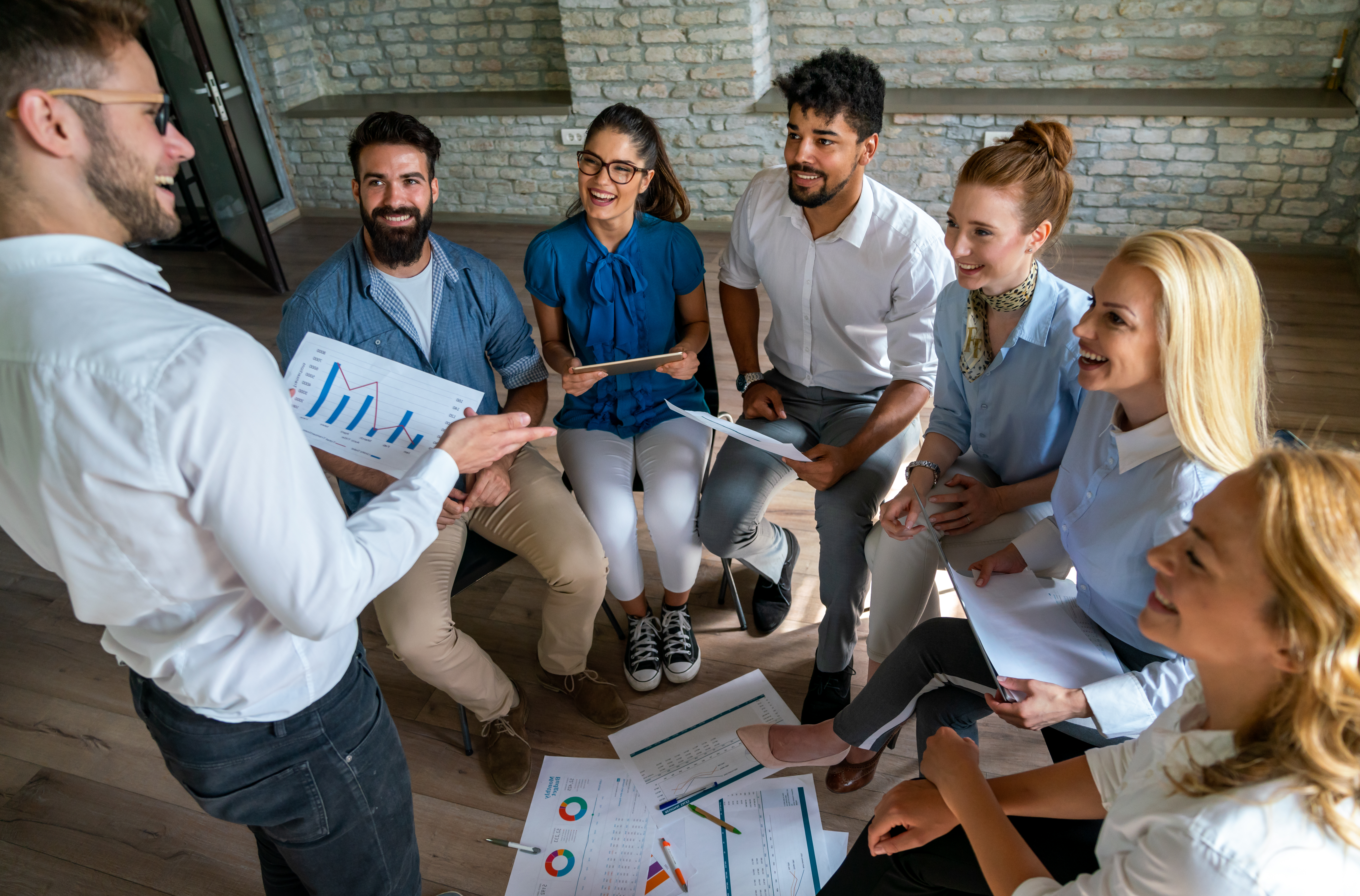 A leader with great team management skills helping his team.